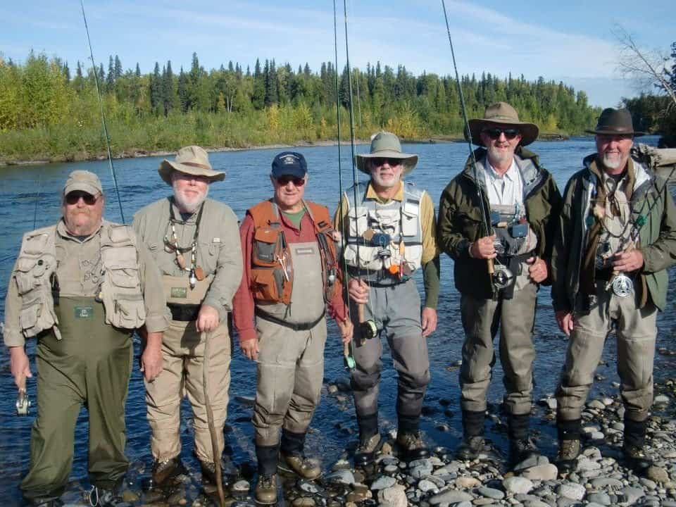 Fishermen at Alaska's Wilderness Place Lodge show off their river gear appropriate for the day's fishing.
