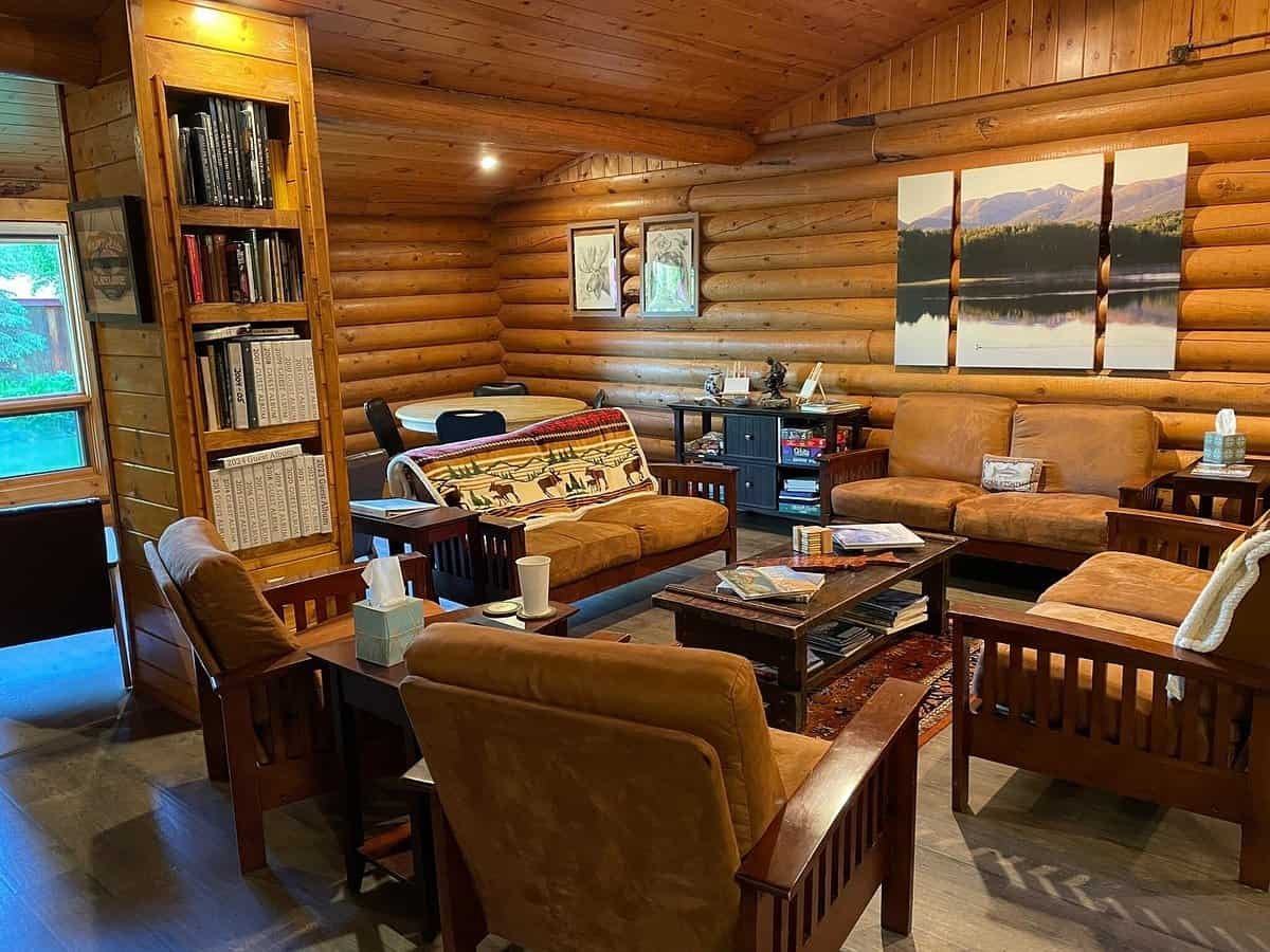 The Wilderness Place Lodge living room area is a great place for books, drinks and stories of fishing and adventure in Alaska.